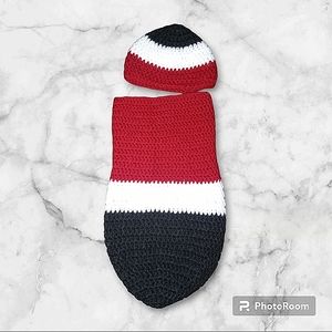 Red, white and black baby cocoon.